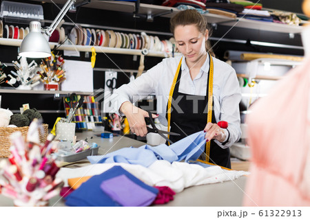 Woman is doing modern patterns for new fashion collection 61322913