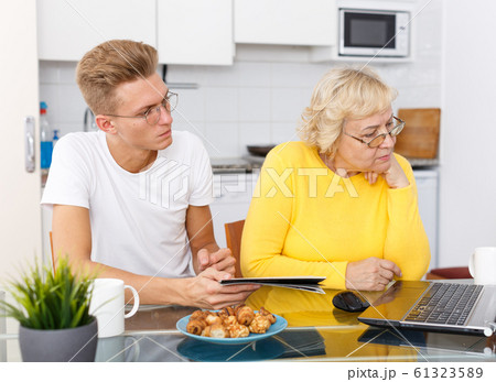 Woman and her son surfing in Internet 61323589