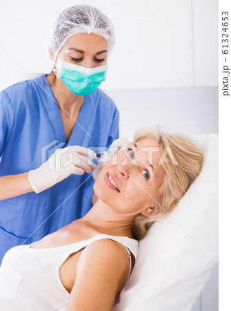 Woman during beauty facial injections 61324653