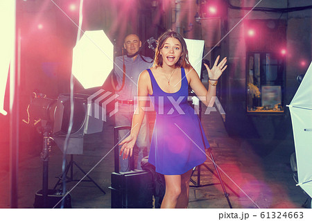 Young attractive woman delighted with professional photo shootin 61324663