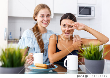 Two smiling girls friends in perfect mood Two smiling girls friends in perfect mood 61324745