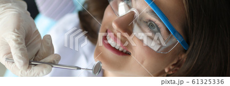 Young smiling beauty woman in dentinst office portrait Young smiling beauty woman in dentinst office portrait 61325336