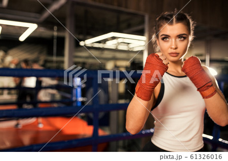 young fit female training, boxing in ring 61326016