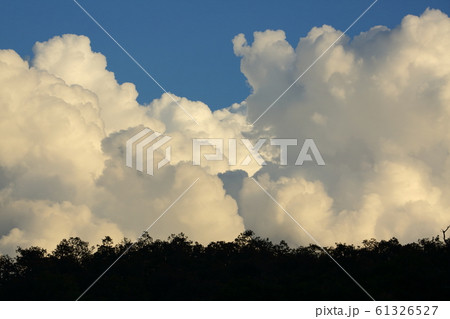landscape image, large cloud on sky above mountain hill 61326527