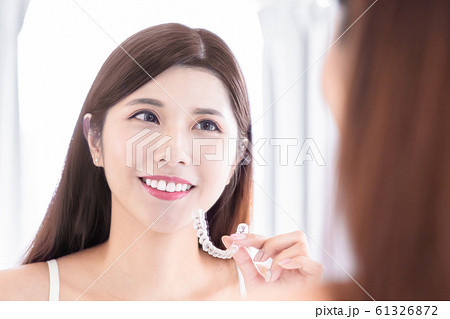woman with teeth invisible brace 61326872