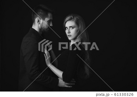 elegant couple in the tender passion. 61330326