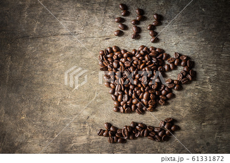 Coffee cup symbol made from coffee beans. Coffee cup symbol made from coffee beans. 61331872