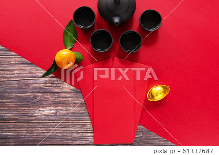 Chinese New Year offering red envelope and Chinese tea pot 61332687