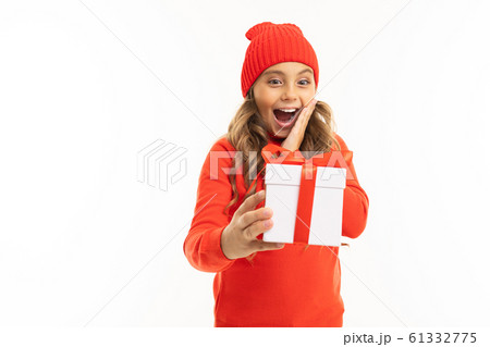 Beautiful caucasian girl holds a white box with gift and has a lot of emotions isolated on white Beautiful caucasian girl holds a white box with gift and has a lot of emotions isolated on white 61332775