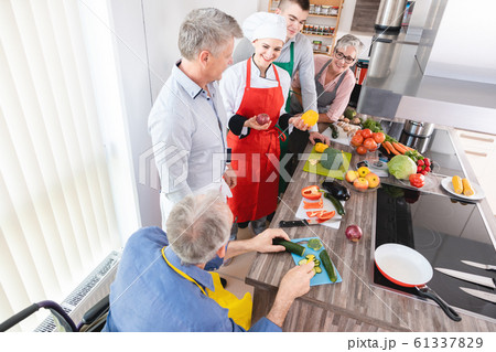 Dietician explaining class in training kitchen the joy of vegetables 61337829