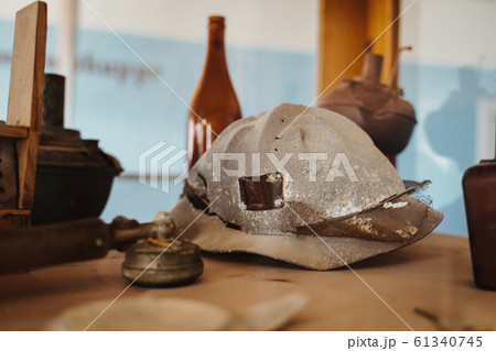 historic old helmet of diamond or gold mineworkers 61340745