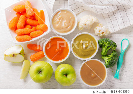 Baby food. Various kinds of bowls of fruit and 61340896