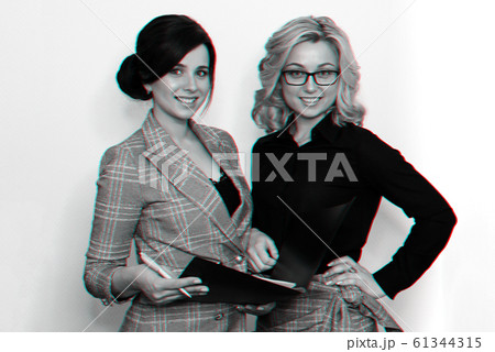 two young successful businesswoman girls with attractive smiles 61344315
