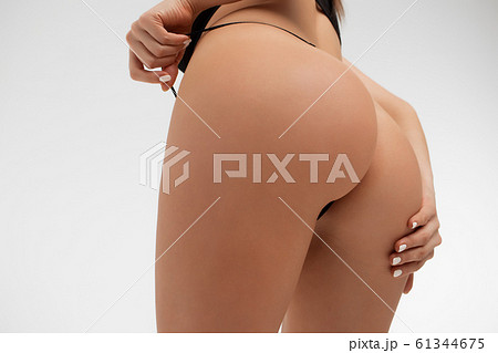 Young lady in lace lingerie leaving buttocks bare 61344675
