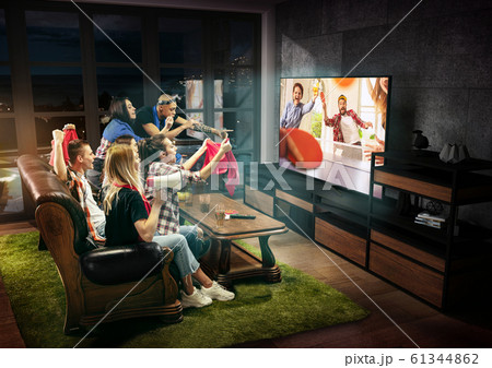 Group of friends watching TV, sport concept, leisure activity Group of friends watching TV, sport concept, leisure activity 61344862
