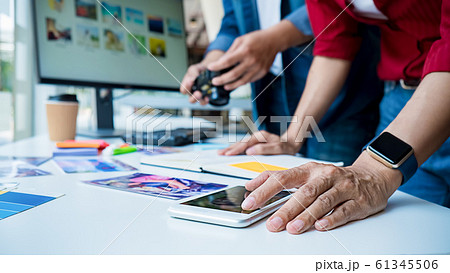 Advertising agency designer creative start-up team discussing ideas in office. 61345506