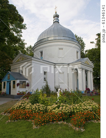 White church with flowers in foreground 61346141