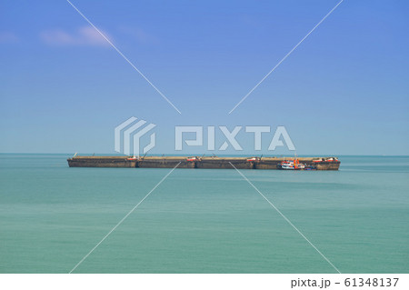 surveillance boat recheck cargo sea barges passing 61348137