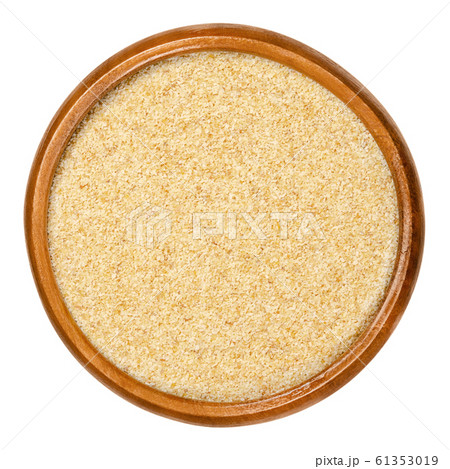Dried garlic granules in wooden bowl Dried garlic granules in wooden bowl 61353019