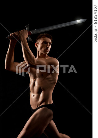 Warrior fight with sword isolated on black. 61354107