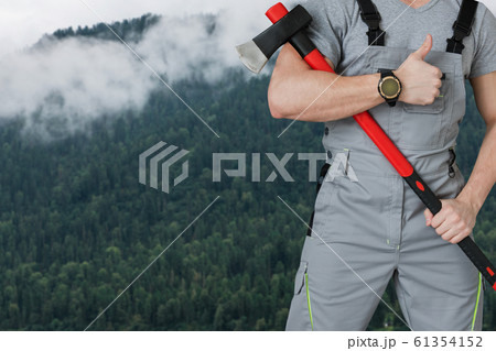 Lumberjack in the woods with an ax 61354152