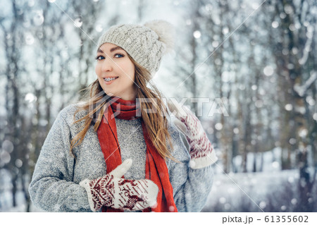 Winter young woman portrait. Beauty Joyful Model Girl laughing and having fun in winter park. Beautiful young female outdoors, Enjoying nature, wintertime 61355602