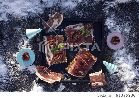 A black tray  with  Traditional  tapas    with  61355836