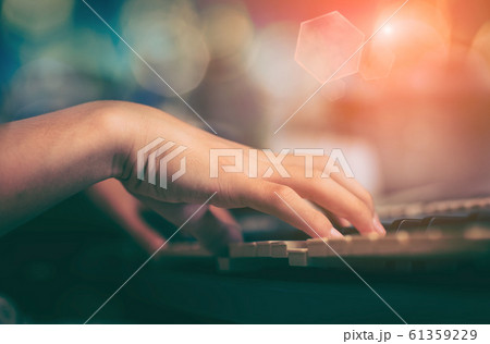 Playing the piano keyboard close up ,Cropped hands 61359229