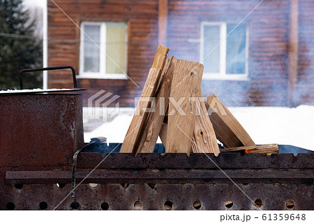 In the grill burning wood. Preparing coals for 61359648