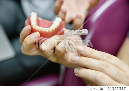 Inivisalign braces or aligner. Dentist advice how invisible orthodontics. 61365537