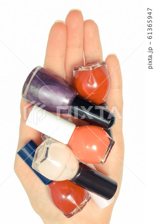 Hand of woman and nail polishes 61365947