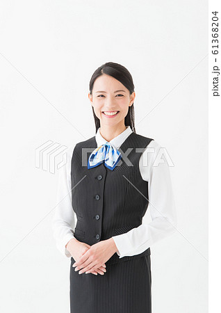制服を着た働く女性(白背景 縦位置) 制服を着た働く女性(白背景 縦位置) 61368204