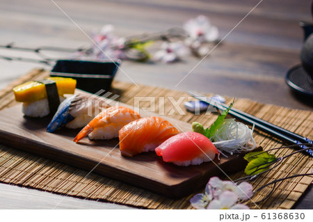 Mix sushi on wood dish, tuna, salmon, sea bass, Mix sushi on wood dish, tuna, salmon, sea bass, 61368630