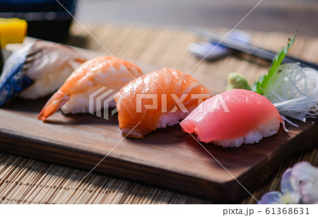 Mix sushi on wood dish, tuna, salmon, sea bass, Mix sushi on wood dish, tuna, salmon, sea bass, 61368631