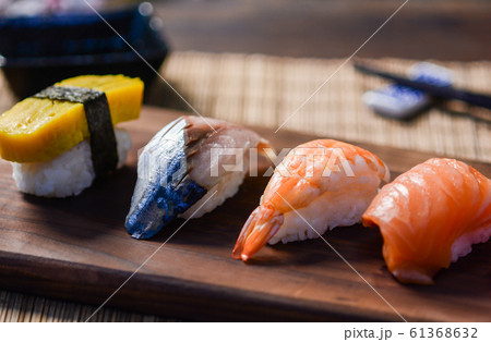 Mix sushi on wood dish, tuna, salmon, sea bass, Mix sushi on wood dish, tuna, salmon, sea bass, 61368632