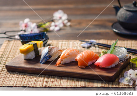 Mix sushi on wood dish, tuna, salmon, sea bass, 61368633