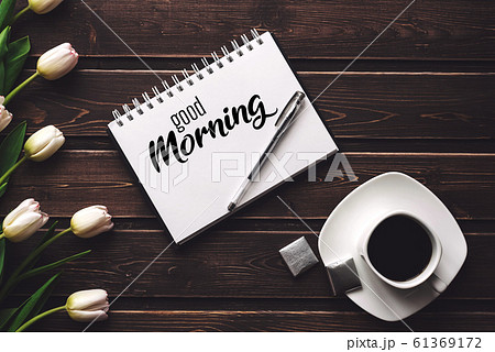 Greeting card with the inscription Good Morning. White tulips and a Cup of coffee Greeting card with the inscription Good Morning. White tulips and a Cup of coffee 61369172