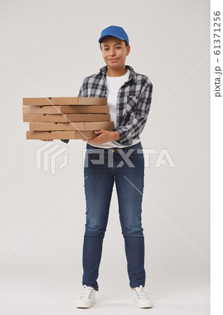 Young Woman Delivering Pizza 61371256