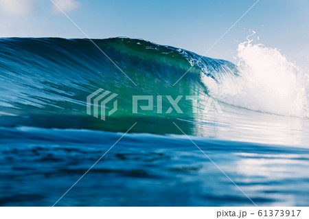 Barrel wave for surfing in ocean. Breaking transparent wave 61373917