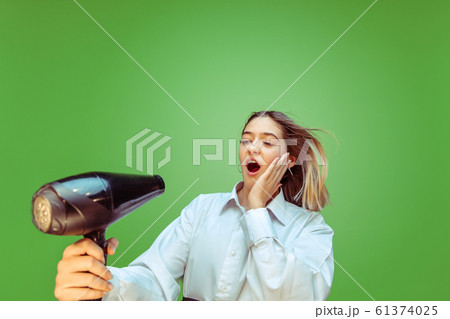 Teen girl dreaming about future profession of makeup artist Teen girl dreaming about future profession of makeup artist 61374025
