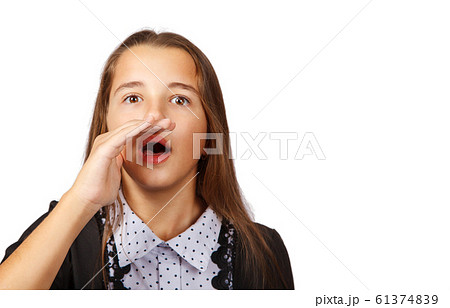 teen girl is calling with a palm to her mouth 61374839