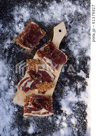 A cutting board  with  Traditional  tapas    with  61376927
