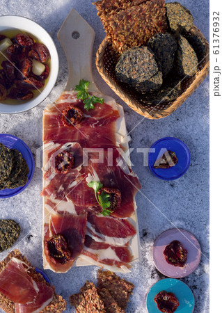A cutting board with Traditional tapas with A cutting board with Traditional tapas with 61376932