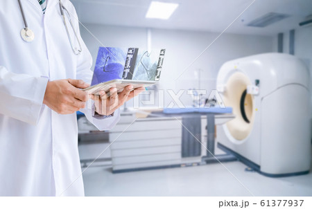 Medical doctor technology View MRI Magnetic Resonance Imaging X-ray results with a tablet 61377937