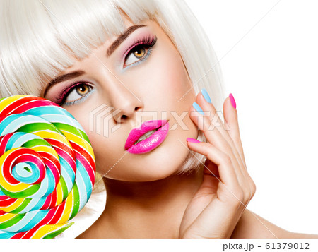 Face of a beautiful girl with pink eye make-up Face of a beautiful girl with pink eye make-up 61379012