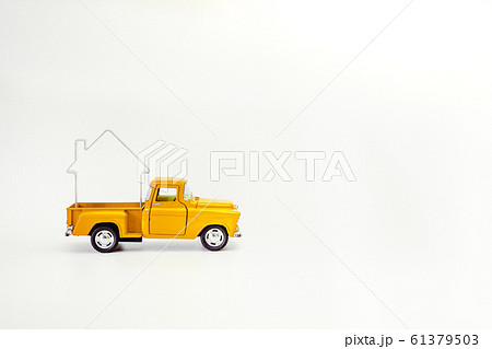 miniature yellow retro car pickup lucky house isolated on white background miniature yellow retro car pickup lucky house isolated on white background 61379503