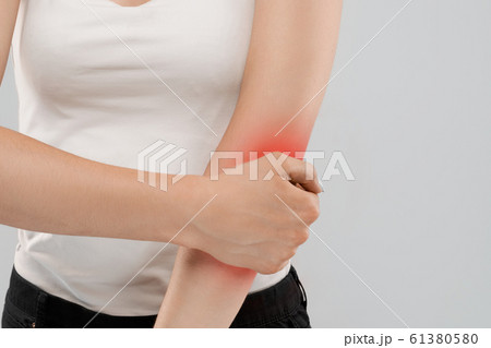 Woman suffering from pain in elbow. Woman suffering from pain in elbow. 61380580