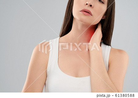Woman showing pain in neck. 61380588