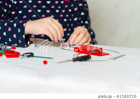 child plays with iron constructor child plays with iron constructor 61380720