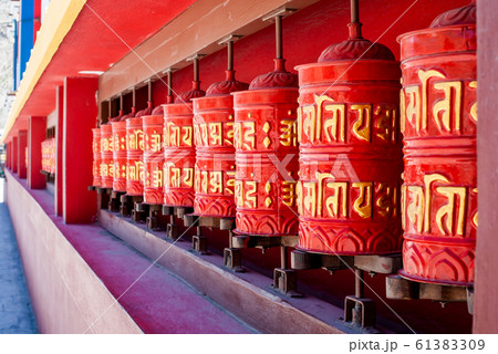 Picture of buddhist prayer wheels in a row 61383309